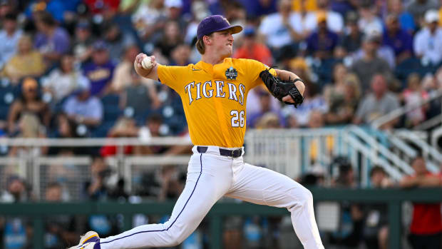 Jun 26, 2023; Omaha, NE, USA; LSU Tigers pitcher Thatcher Hurd (26) throws against the Florida Gators in the third inning at Charles Schwab Field Omaha.